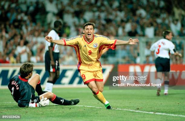 Viorel Moldovan of Romania celebrates after scoring past David Seaman of England during a 1998 FIFA World Cup group match at the Stade de Toulouse on...