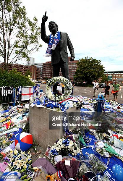 Tributes and memories laid by fans are seen at the feet of the Sir Bobby Robson statue outside Portman Road, the stadium of Ipswich Town FC on August...