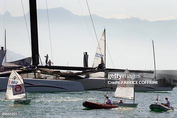 America's Cup defender Alinghi's new giant high tech catamaran "Alinghi 5" prepares to parade at Lake Geneva on the Swiss national day on August 1,...