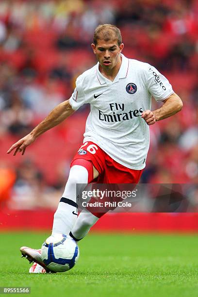 Christophe Jallet of PSG passes the ball during the Emirates Cup match between Glasgow Rangers and Paris Saint-Germain at the Emirates Stadium on...