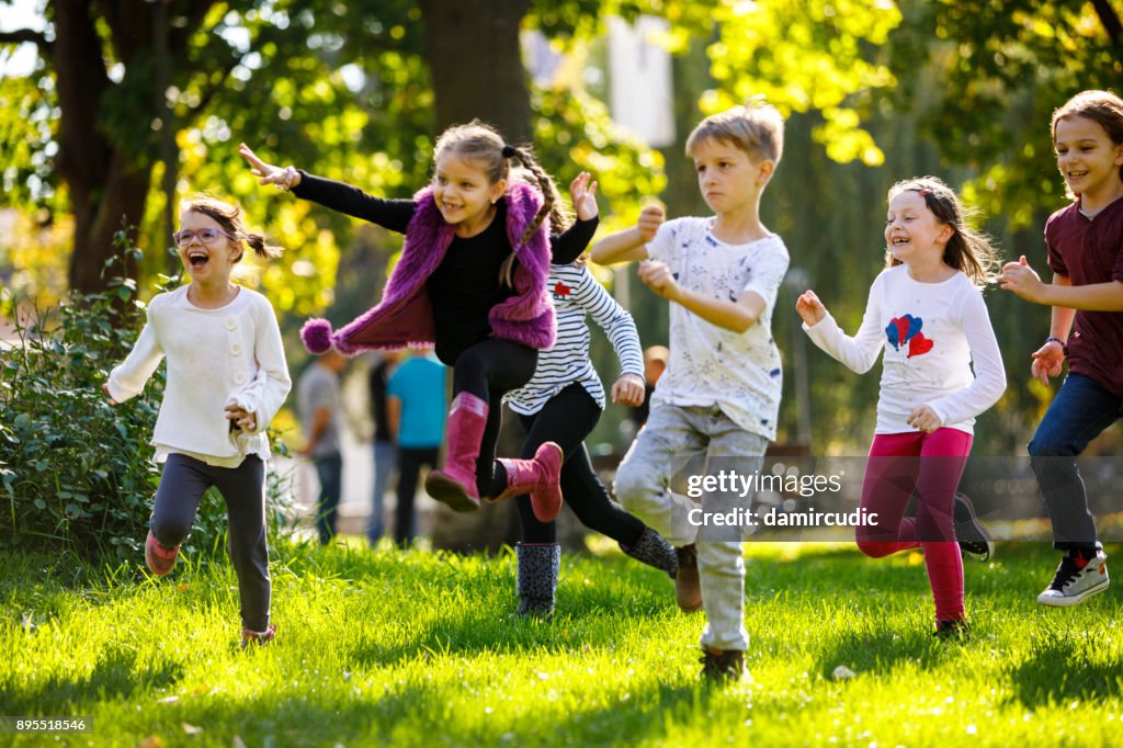 Happy children running outside