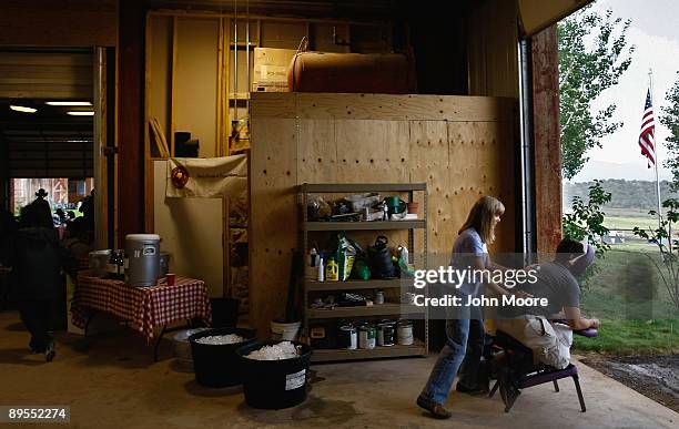 Massage therapist Mary Ann Lunger works on a wounded U.S. Serviceman on July 31, 2009 at the Yarmony Lodge near McCoy, Colorado. A group of a dozen...