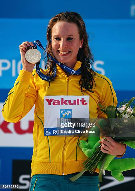 Marieke Guehrer of Australia receives the gold medal during the medal ceremony for the Women's 50m Butterfly Final during the 13th FINA World...