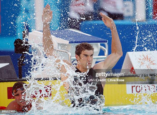 Michael Phelps of the United States celebrates victory in the Men's 100m Butterfly Final during the 13th FINA World Championships at the Stadio del...