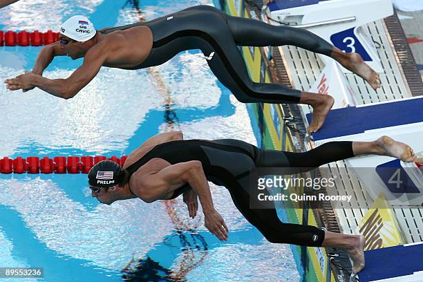 Milorad Cavic of Serbia and Michael Phelps of the United States compete in the Men's 100m Butterfly Final during the 13th FINA World Championships at...