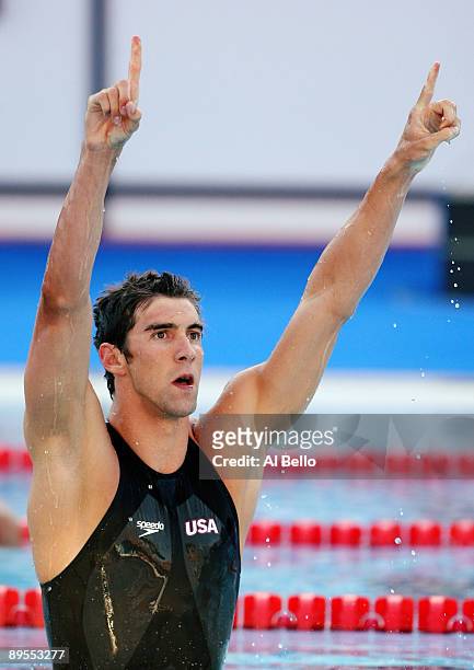 Michael Phelps of the United States celebrates victory in the Men's 100m Butterfly Final during the 13th FINA World Championships at the Stadio del...