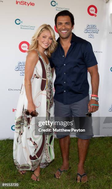 Host Kelly Ripa and actor Mark Consuelos attend QVC's Super Saturday Live at Nova's Ark Project on August 1, 2009 in Water Mill, New York.