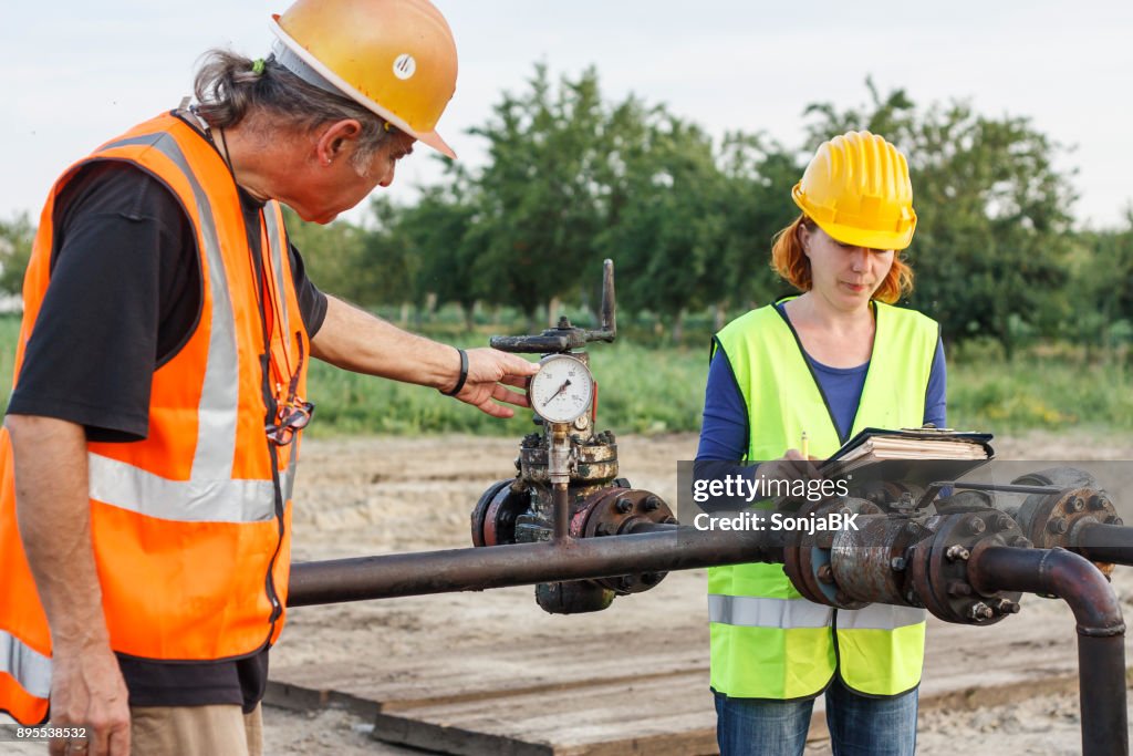 Two engineers at oil field