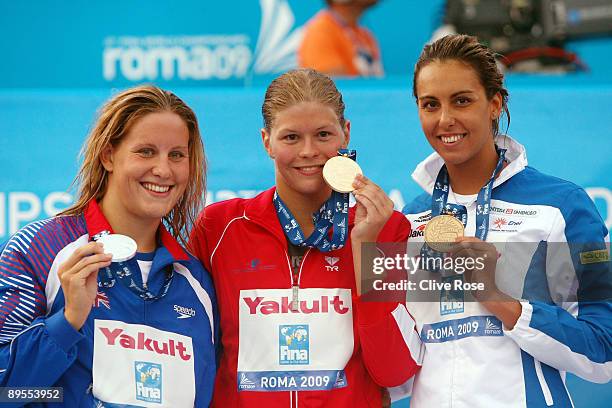 Joanne Jackson of Great Britain celebrates the silver medal, Lotte Friis of Denmark the gold medal and Alessia Filippi of Italy the bronze medal...