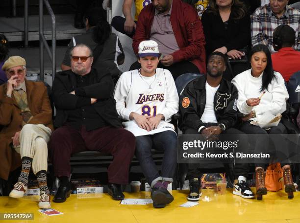 Record producer Lou Adler, actor Jack Nicholson, Ray Nicholson, actor Kevin Hart and his wife Eniko Parrish attend a basketball game between the...