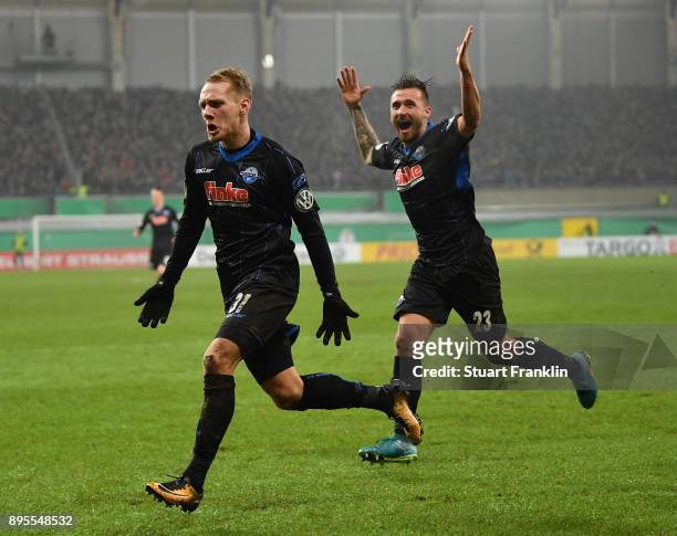 Ben Zolinski of Paderborn celebrates scoring his goal with Robin Krausse during the DFB Cup match between SC Paderborn and FC Ingolstadt at Benteler...