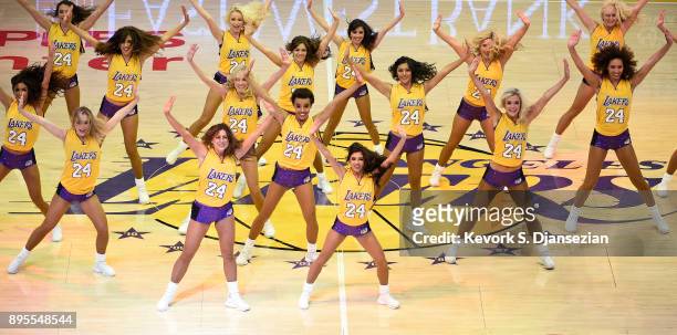 Laker Girls perform wearing one of the numbers of Los Angeles Lakers legend Kobe Bryant jersey which was retired during the basketball game between...