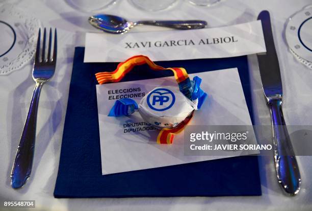Picture shows a voting ballot in an envelope and a traditional 'polvoron' christmas shortbread cookie reserved for Catalan Popular Party - PPC...
