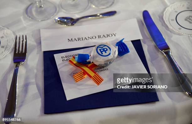 Picture shows a voting ballot in an envelope and a traditional 'polvoron' christmas shortbread cookie reserved for Spanish Prime Minister Mariano...