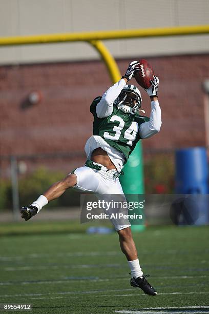 Cornerback Marquice Cole of the New York Jets grabs a ball during New York Jets Training Camp at the State University of New York at Cortland, on...