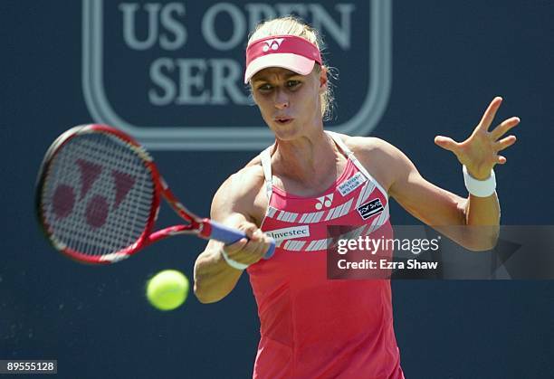 Elena Dementieva of Russia returns a forehand to Venus Williams during their semifinal match on Day 6 of the Bank of the West Classic August 1, 2009...