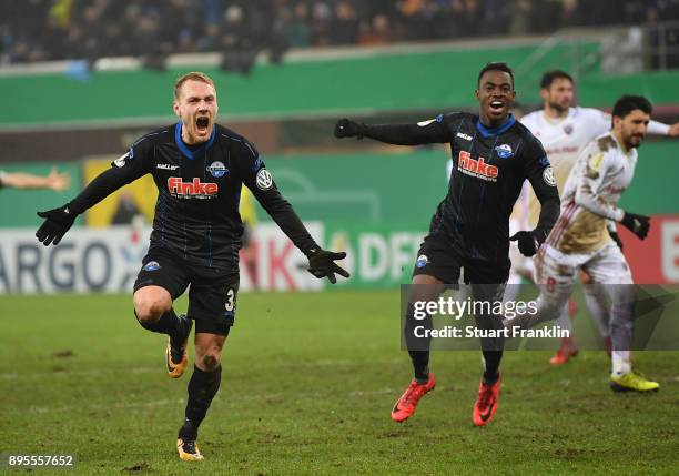 Ben Zolinski of Paderborn celebrates scoring his goal with Christopher Antwi-Adjej during the DFB Cup match between SC Paderborn and FC Ingolstadt at...