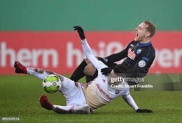 Ben Zolinski of Paderborn is challenged by Alfredo Morales of Ingolstadt during the DFB Cup match between SC Paderborn and FC Ingolstadt at Benteler...