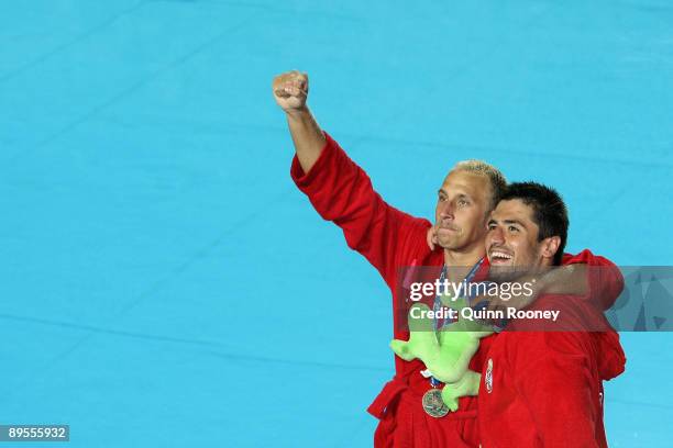 Milan Aleksic and Zivko Gocic of Serbia celebrate winning the men's gold medal water polo match between Serbia and Spain during the 13th FINA World...