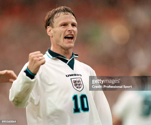 Teddy Sheringham of England celebrates during the UEFA Euro 96 group match between the Netherlands and England at Wembley Stadium on June 18, 1996 in...