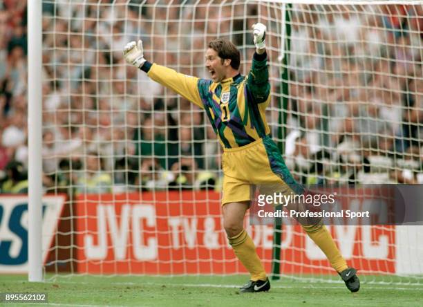 David Seaman of England celebrates after saving a penalty in the shoot-out during the UEFA Euro 96 Quarter Final between Spain and England at Wembley...