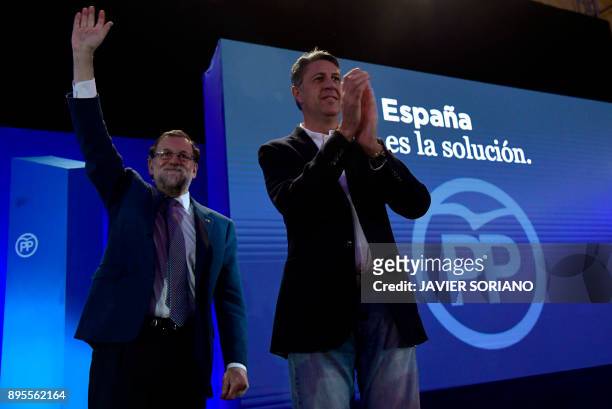 Spanish Prime Minister Mariano Rajoy and Catalan Popular Party leader and candidate for the upcoming Catalan regional election Xavier Garcia Albiol...