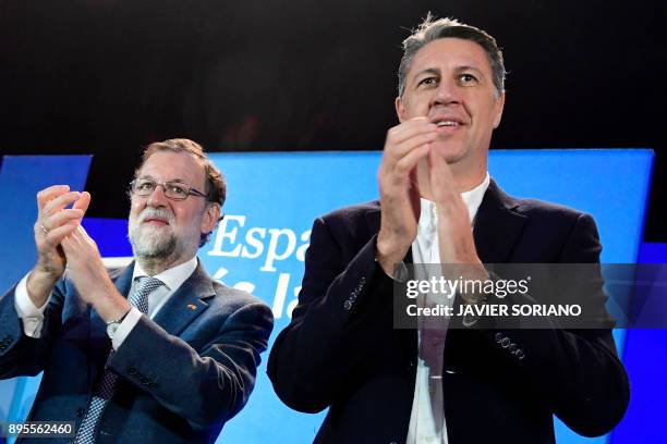 Spanish Prime Minister Mariano Rajoy and Catalan Popular Party leader and candidate for the upcoming Catalan regional election Xavier Garcia Albiol...