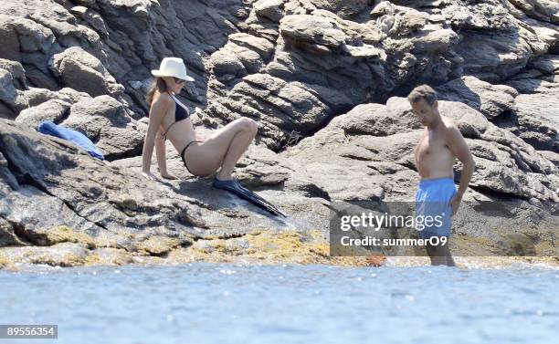 French President Nicolas Sarkozy and his wife Carla Bruni-Sarkozy vacation at le Cap Negre on August 1, 2009 in Saint-Tropez, France.
