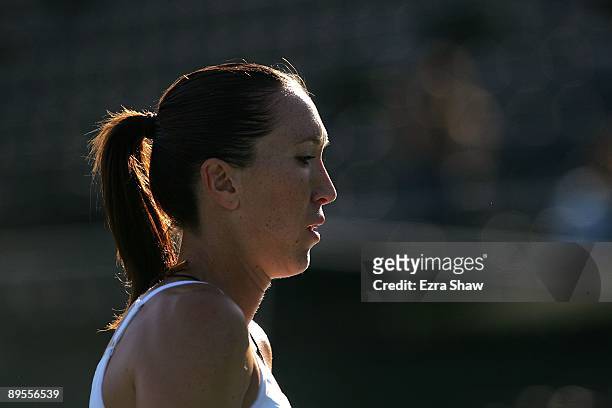 Jelena Jankovic of Serbia walks back to her chair during a change over in her match against Marion Bartoli of France during their quarterfinal match...