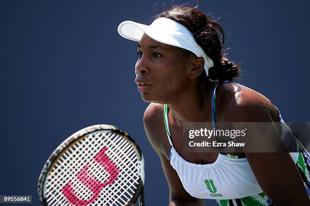 Venus Williams of the USA waits to return a serve from Alla Kudryavtseva of Russia during their match on Day 4 of the Bank of the West Classic at...
