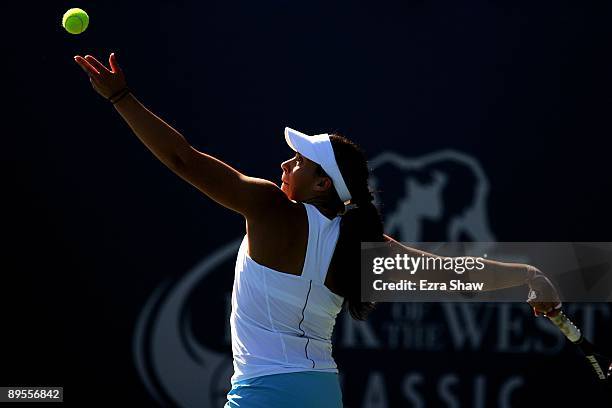 Marion Bartoli of France serves to Melanie Oudin of the USA during their match on Day 4 of the Bank of the West Classic at Stanford University on...