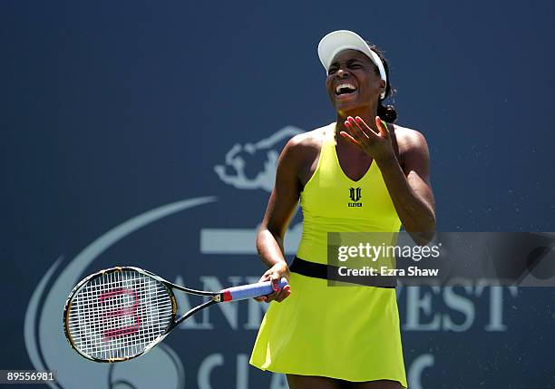 Venus Williams reacts after losing a point to Elena Dementieva of Russia in their semifinal match on Day 6 of the Bank of the West Classic August 1,...