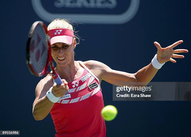 Elena Dementieva of Russia returns a shot to Venus Williams during their semifinal match on Day 6 of the Bank of the West Classic August 1, 2009 in...