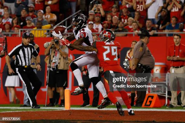 Atlanta Falcons wide receiver Justin Hardy catches a pass well being covered by Tampa Bay Buccaneers cornerback Ryan Smith in the end zone for a...