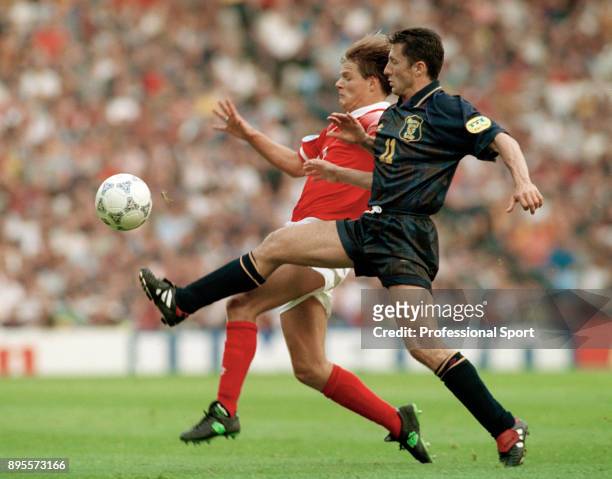 John Collins of Scotland and Johann Vogel of Switzerland battle for the ball during a UEFA Euro 96 group match at Villa Park on June 18, 1996 in...