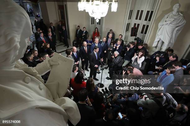 Speaker of the House Paul Ryan is joined by House Republican leaders while talking to reporters following passage of the Tax Cuts and Jobs Act in the...