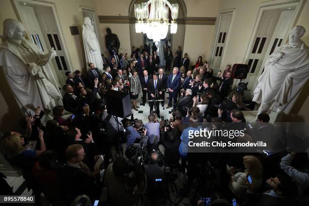 Speaker of the House Paul Ryan is joined by House Republican leaders while talking to reporters following passage of the Tax Cuts and Jobs Act in the...