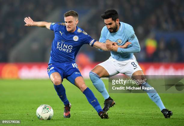 Andy King of Leicester City holds off Ilkay Gundogan of Manchester City during the Carabao Cup Quarter-Final match between Leicester City and...