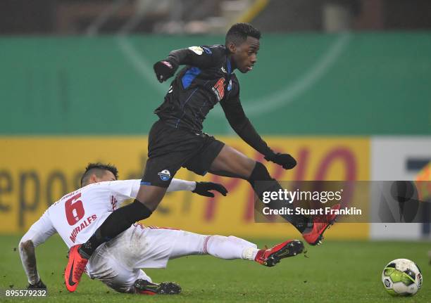 Christopher Antwi-Adjej of Paderborn is challenged by Alfredo Morales of Ingolstadt during the DFB Cup match between SC Paderborn and FC Ingolstadt...