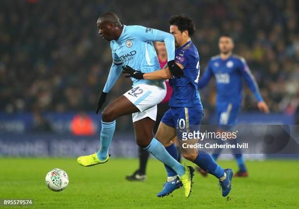 Yaya Toure of Manchester City fends off Shinji Okazaki of Leicester City during the Carabao Cup Quarter-Final match between Leicester City and...