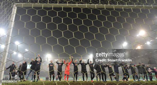 The players of Paderborn celebrate after winning the DFB Cup match between SC Paderborn and FC Ingolstadt at Benteler Arena on December 19, 2017 in...