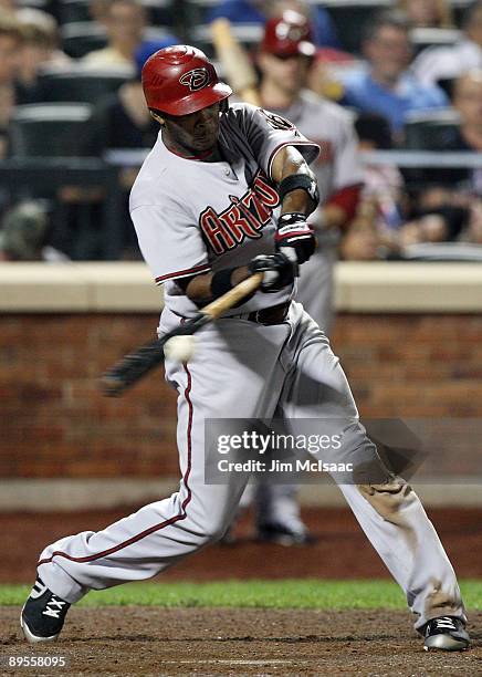 Justin Upton of the Arizona Diamondbacks connects for a RBI single in the sixth inning against the New York Mets on August 1, 2009 at Citi Field in...