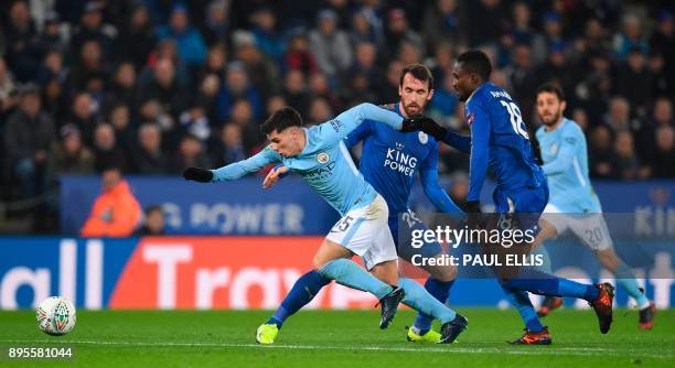 Manchester City's Spanish-born midfielder Brahim Diaz takes on Leicester City's Ghanaian midfielder Daniel Amartey and Leicester City's Austrian...