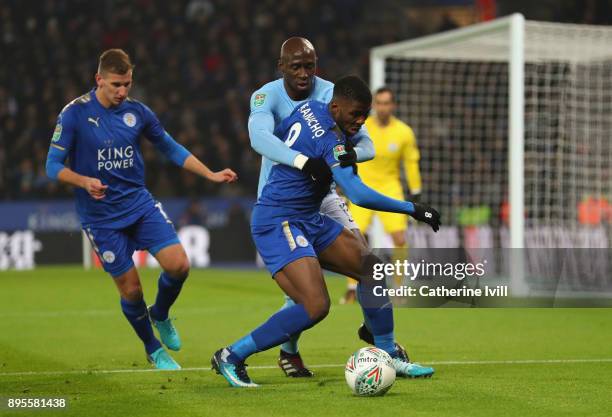 Kelechi Iheanacho of Leicester City tangles with Eliaquim Mangala of Manchester City during the Carabao Cup Quarter-Final match between Leicester...