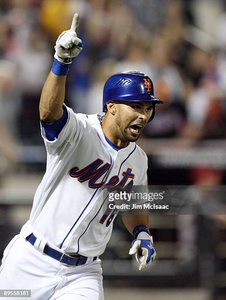 Angel Pagan of the New York Mets celebrates after hitting a eighth inning grand slam against the Arizona Diamondbacks on August 1, 2009 at Citi Field...