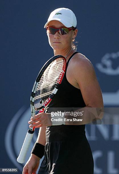Samantha Stosur of Australia pauses while playing Marian Bartoli of France during their semifinal match on Day 6 of the Bank of the West Classic...