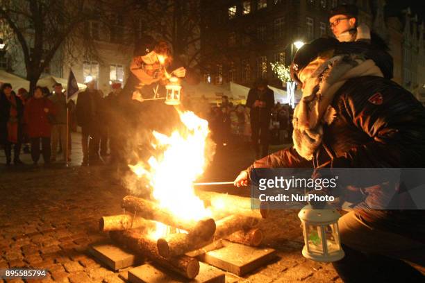 Scouts are seen during the Peace Light of Bethlehem transfer ceremony are seen in Gdansk, Poland on 19 December 2017 The Peace Light of Bethlehem is...