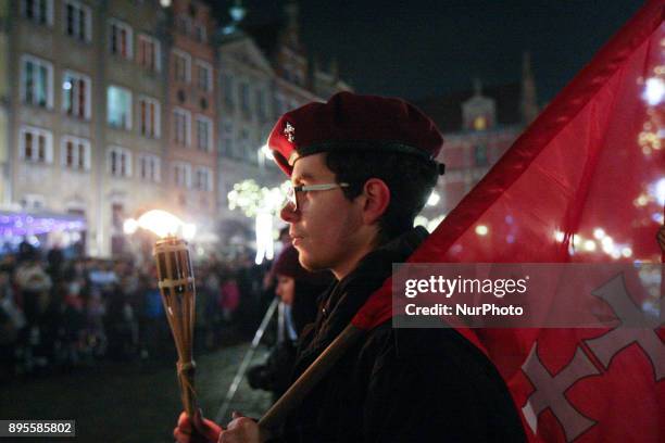 Scouts are seen during the Peace Light of Bethlehem transfer ceremony are seen in Gdansk, Poland on 19 December 2017 The Peace Light of Bethlehem is...