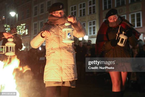 Scouts are seen during the Peace Light of Bethlehem transfer ceremony are seen in Gdansk, Poland on 19 December 2017 The Peace Light of Bethlehem is...