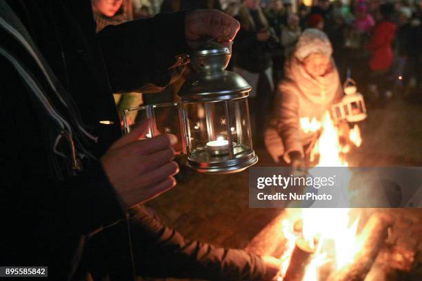 Scouts are seen during the Peace Light of Bethlehem transfer ceremony are seen in Gdansk, Poland on 19 December 2017 The Peace Light of Bethlehem is...